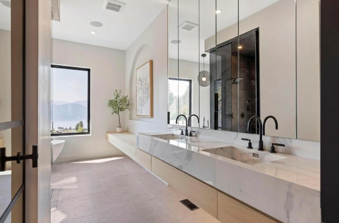Stellar Craft Cabinetry Inc. modern double-sink bathroom vanity with custom cabinetry and marble countertops