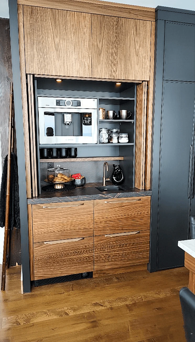 Stellar Craft Cabinetry Inc. custom modern kitchen cabinetry with built-in open shelves, stone backsplash, and warm wood drawers