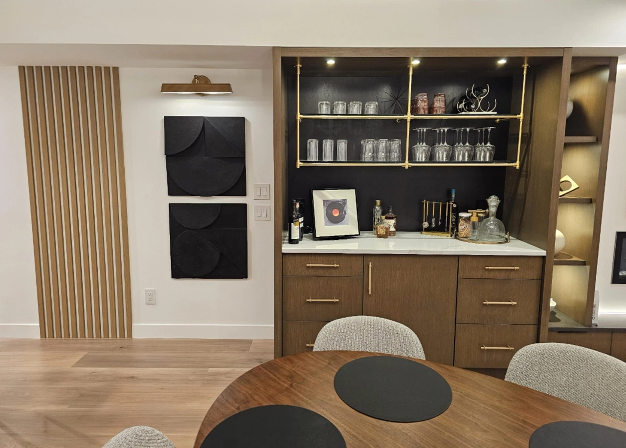 Stellar Craft Cabinetry Inc. custom cabinet and bar display with glassware and open shelving interior