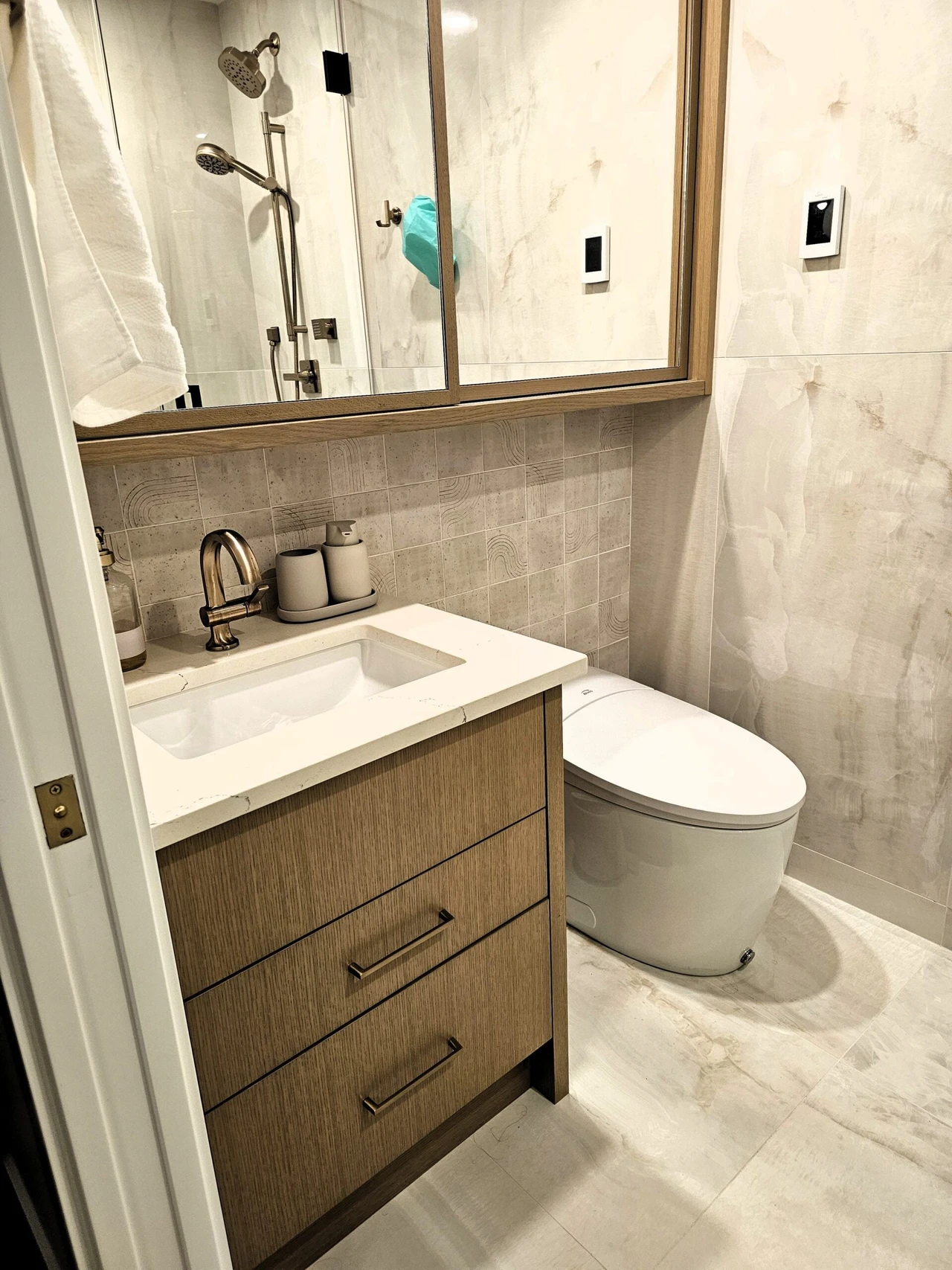 Stellar Craft Cabinetry bathroom vanity with undermount sink, chrome faucet, and matching wood cabinetry