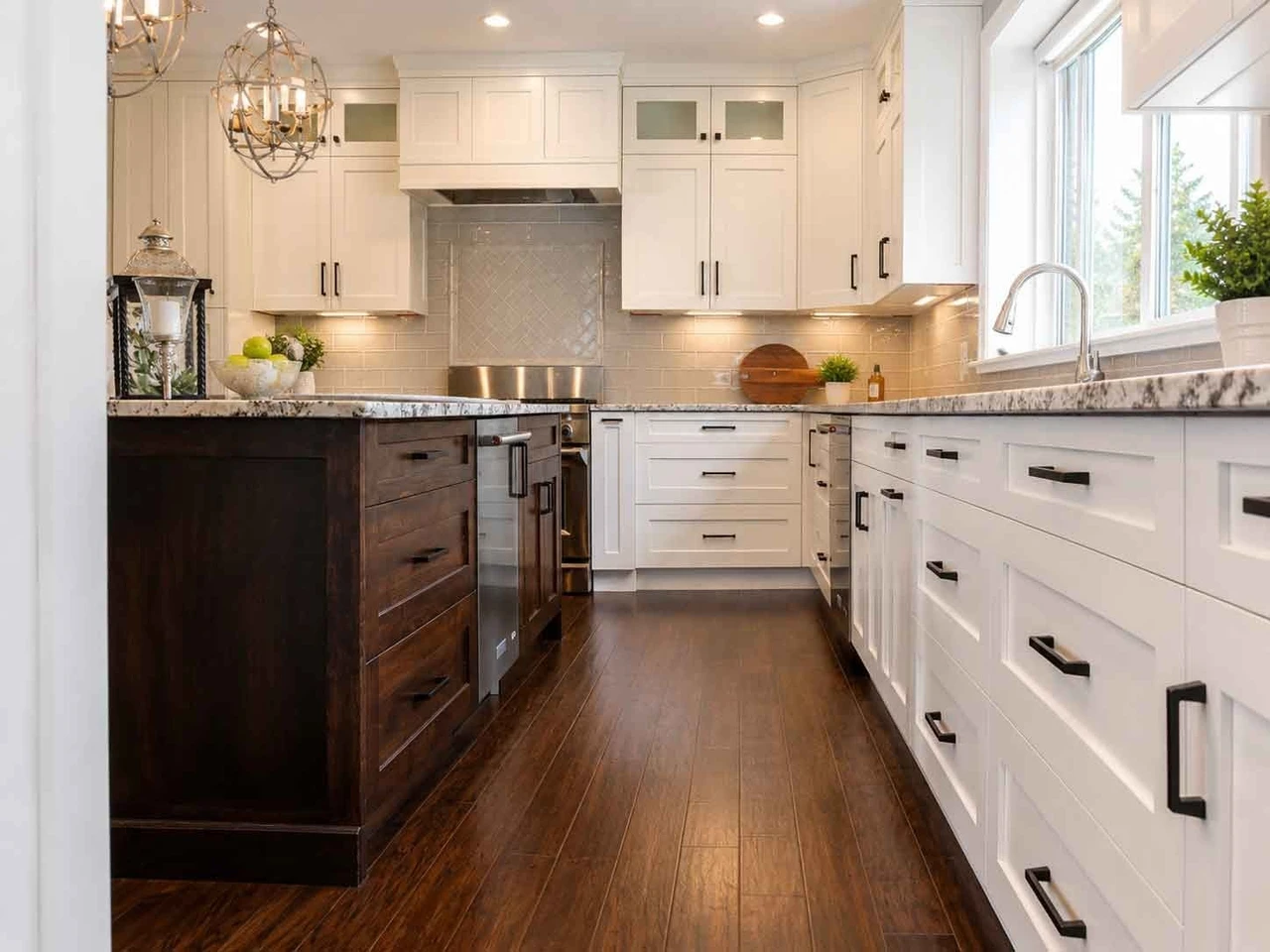 Stellar Craft Cabinetry Inc. custom white kitchen cabinetry with dark wood island and modern hardware