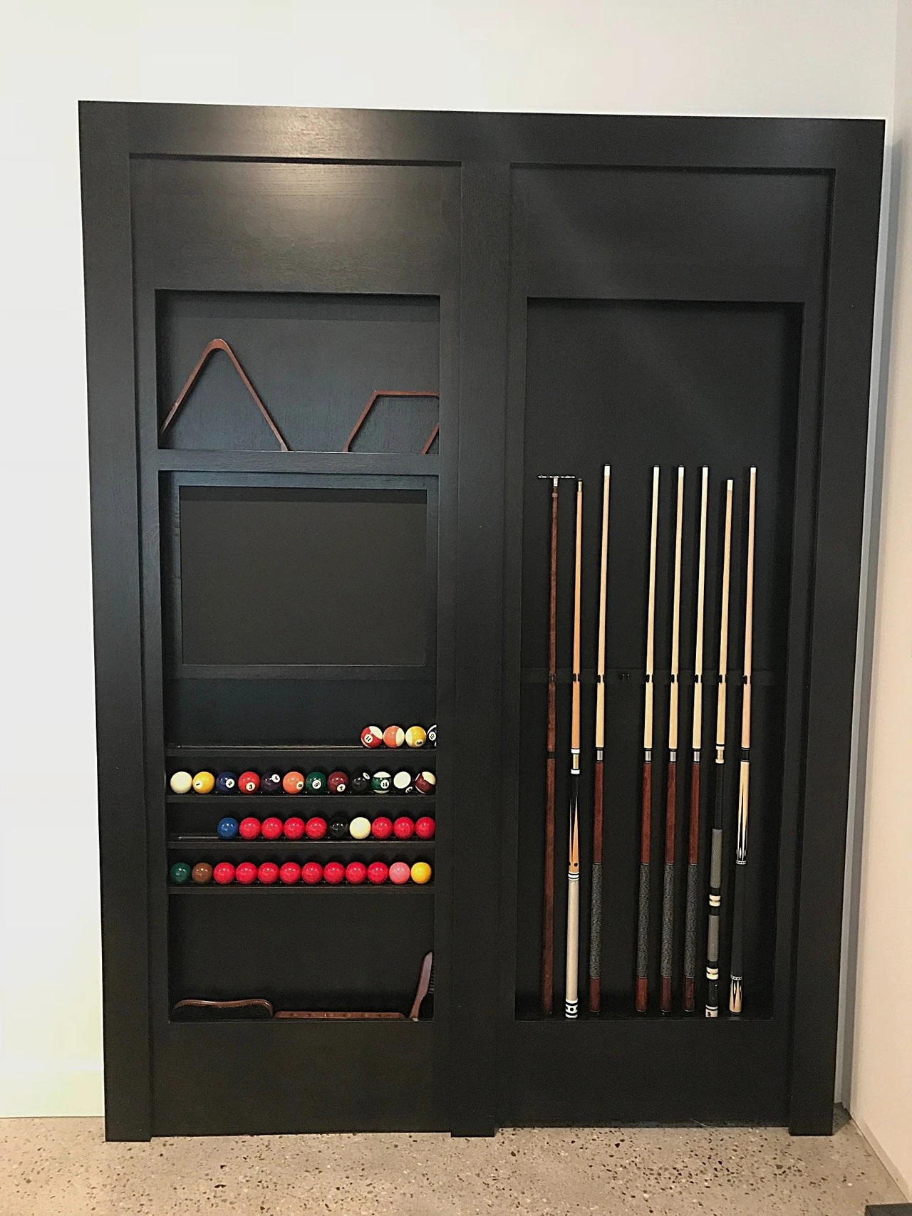 Stellar Craft Cabinetry Inc. custom cabinet storage for billiard cues and balls