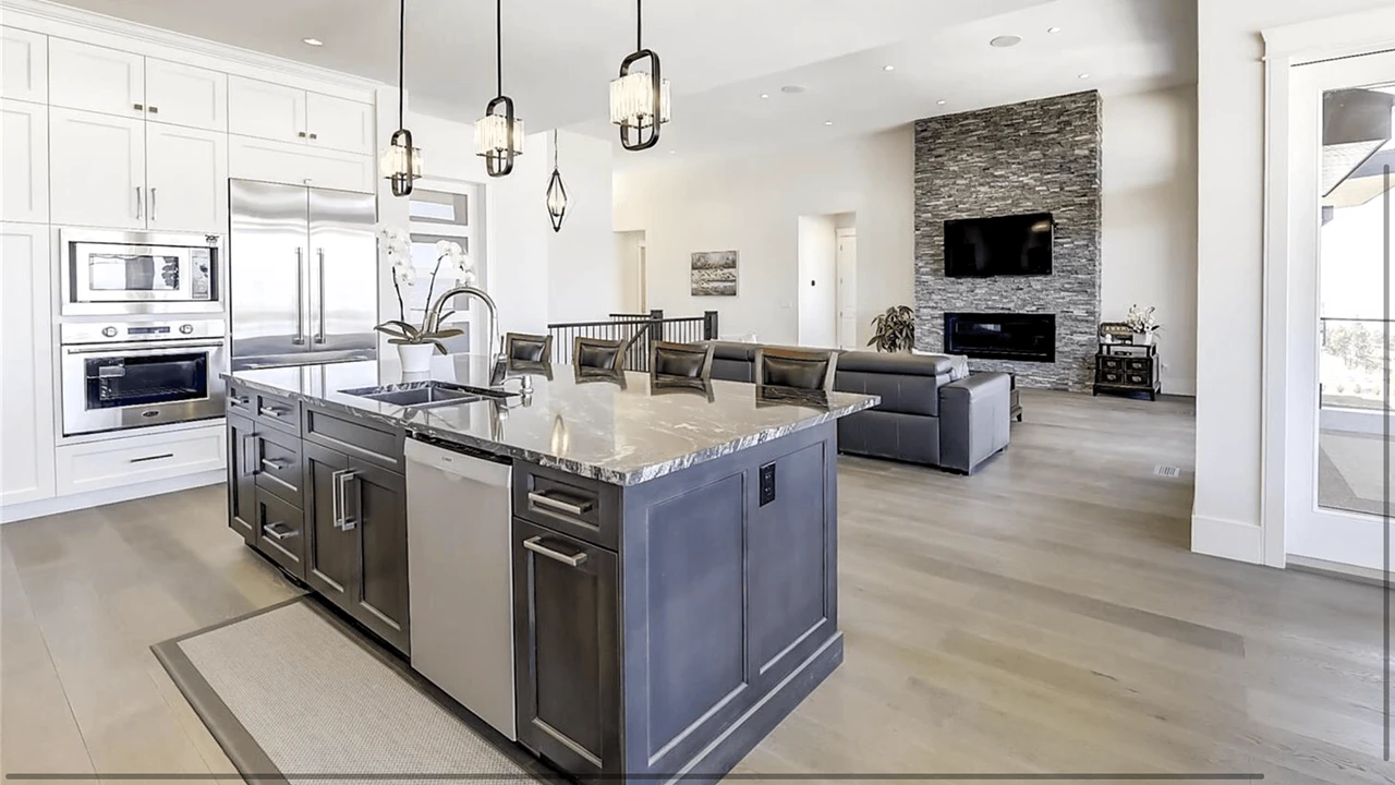 Stellar Craft Cabinetry Inc. modern kitchen with custom cabinetry, island, and living area