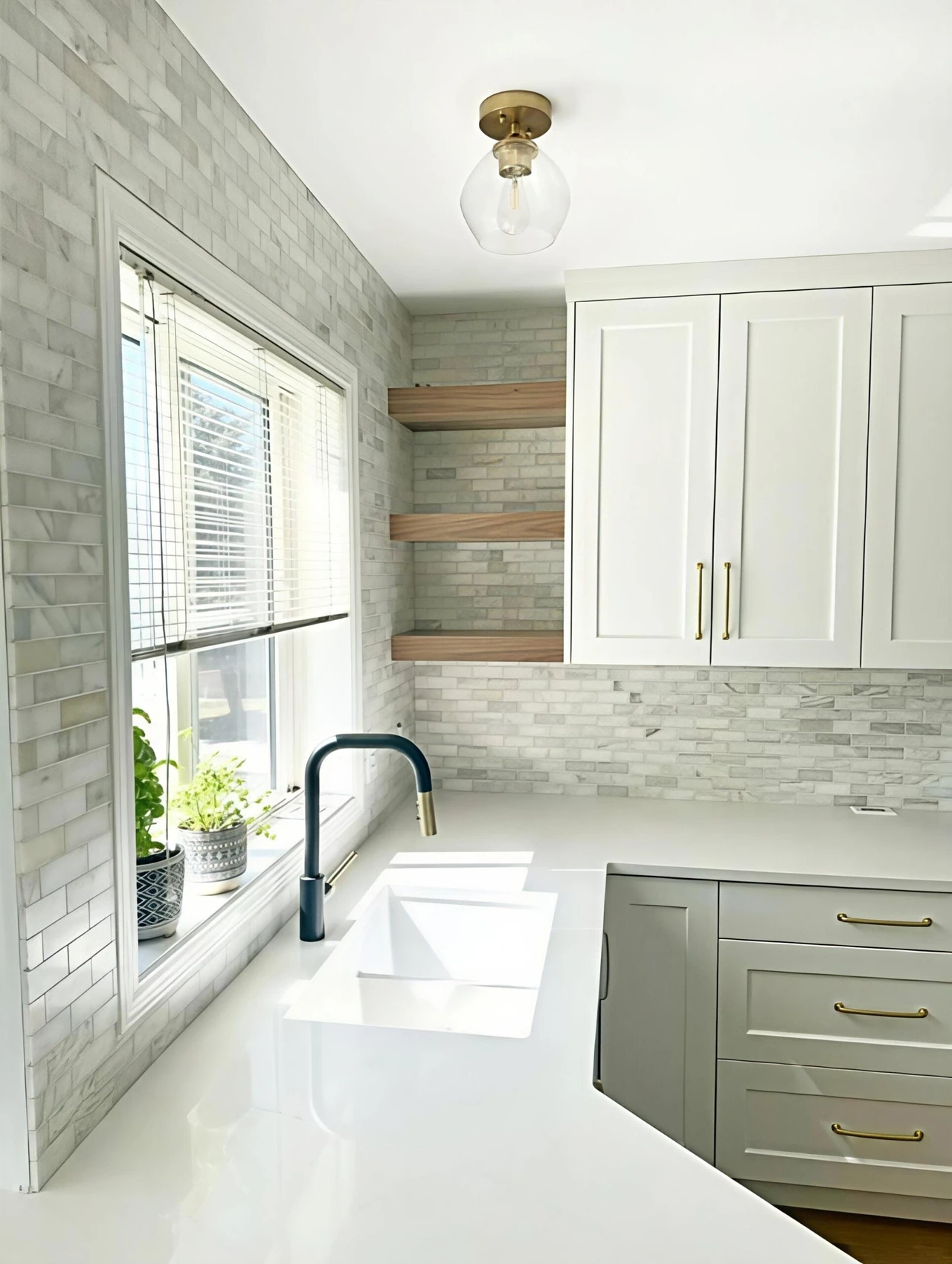 Stellar Craft Cabinetry Inc. modern kitchen with white cabinetry, stone backsplash, and window