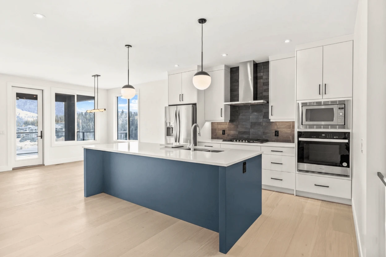 Stellar Craft Cabinetry Inc. modern kitchen with custom cabinetry, island, and stone backsplash