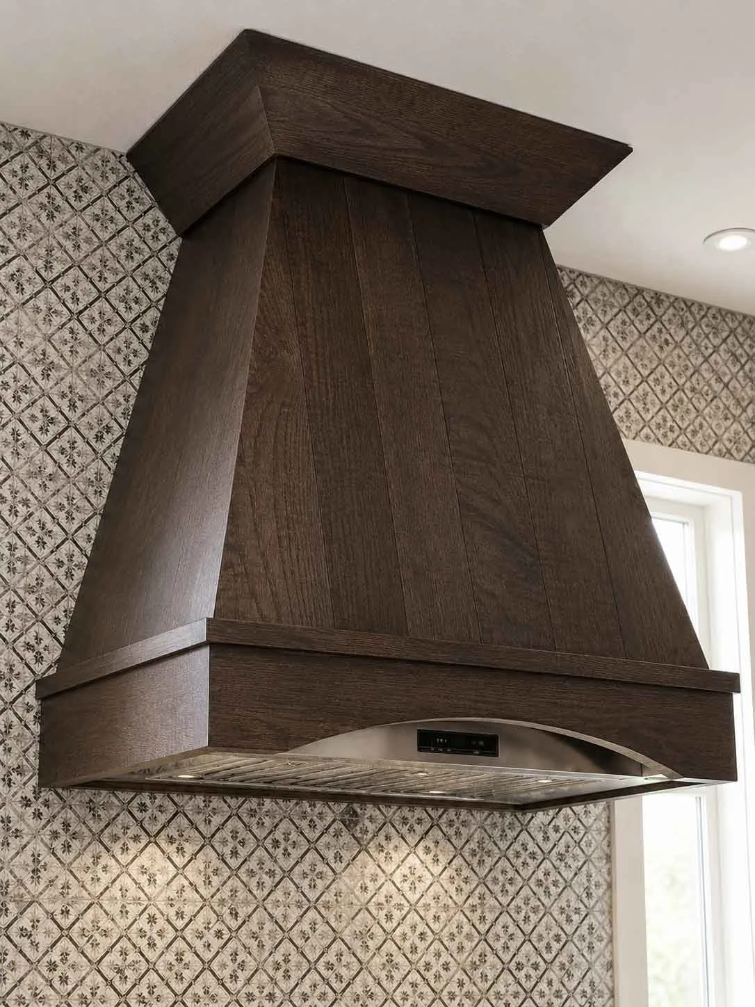 Stellar Craft Cabinetry Inc. dark wood custom range hood in a modern kitchen