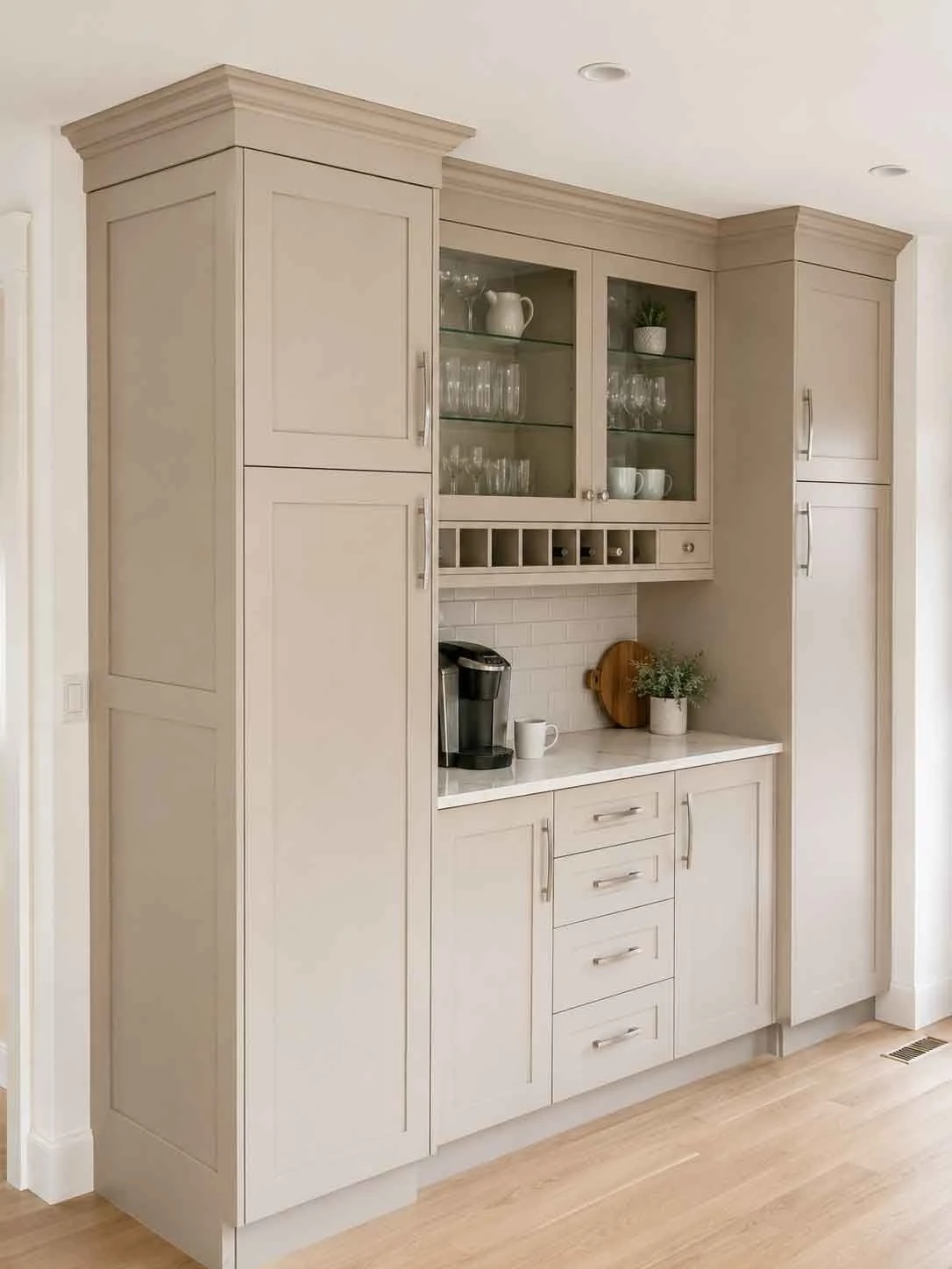 Stellar Craft Cabinetry Inc. custom white cabinet wall with glass-front doors and pantry storage