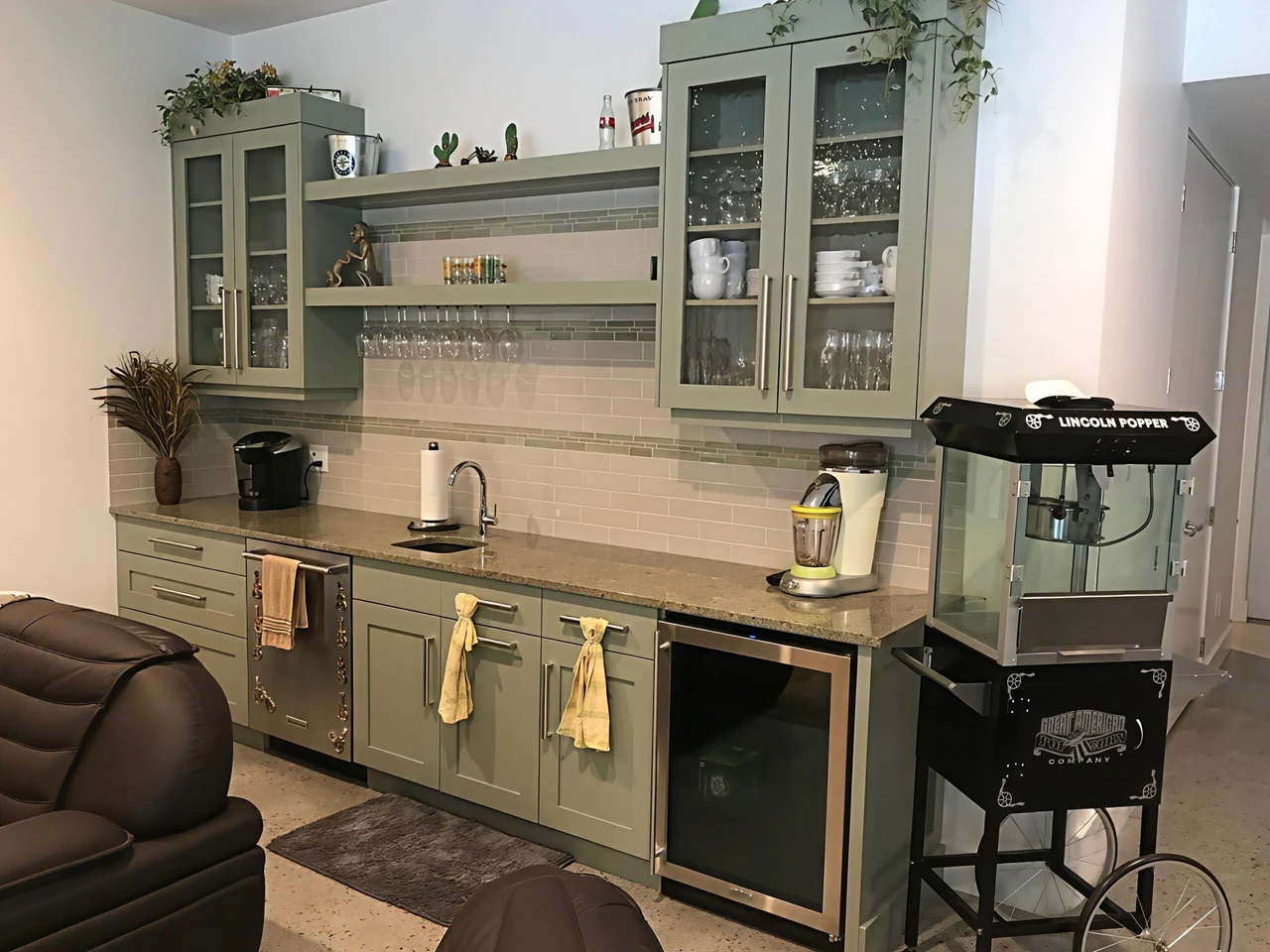 Stellar Craft Cabinetry Inc. custom kitchen cabinetry with glass-front uppers, granite counters, and modern workspace